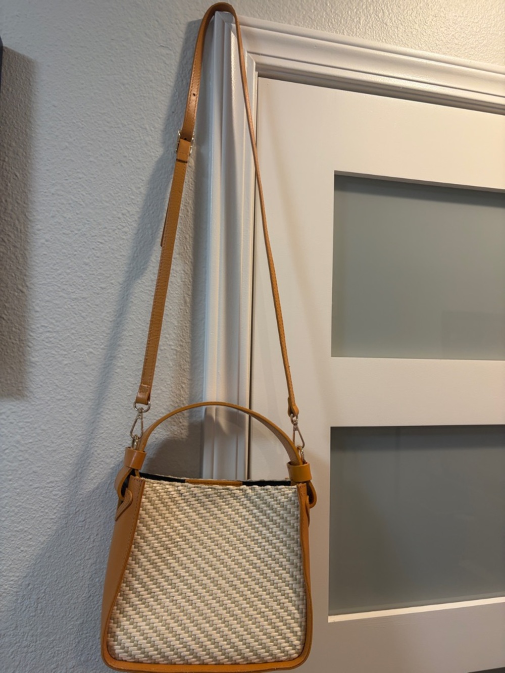 Woven Straw Crossbody with Tan Leather Trim and Adjustable Strap